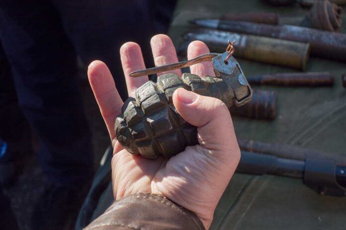 Grenade,In,A,Man's,Hand