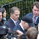 Hunter and Joe Biden among a crowd of reporters