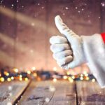 Santa hand giving thumbs up Christmas lights
