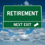 Green road sign saying "Retirement Next Exit."