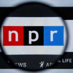 Magnifying glass over NPR logo on screen