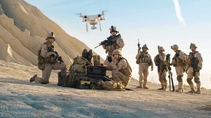 676000819 featured image Soldiers operating a drone in a desert environment.