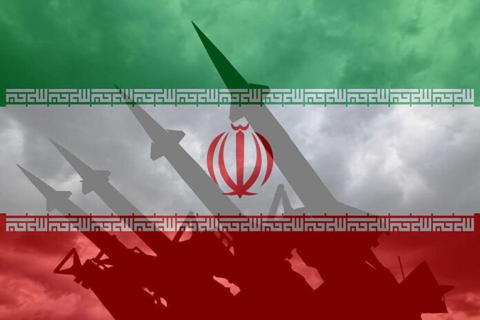 1660469842 featured image Iranian flag overlaid with image of military missiles.