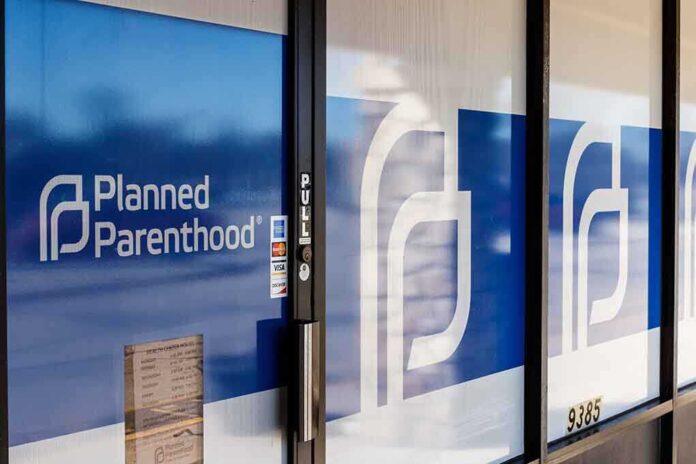 1348319024 featured image Planned Parenthood office entrance with logo and signs.