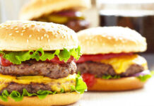 Cheeseburgers with lettuce tomato and sesame seed buns