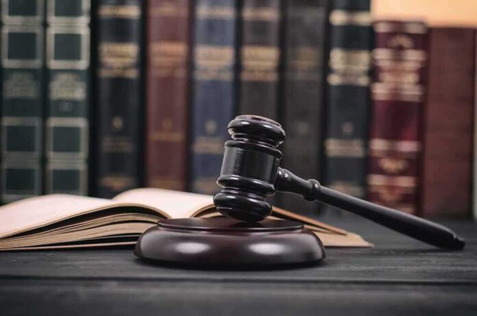 1686878860 featured image Gavel and open book in library setting