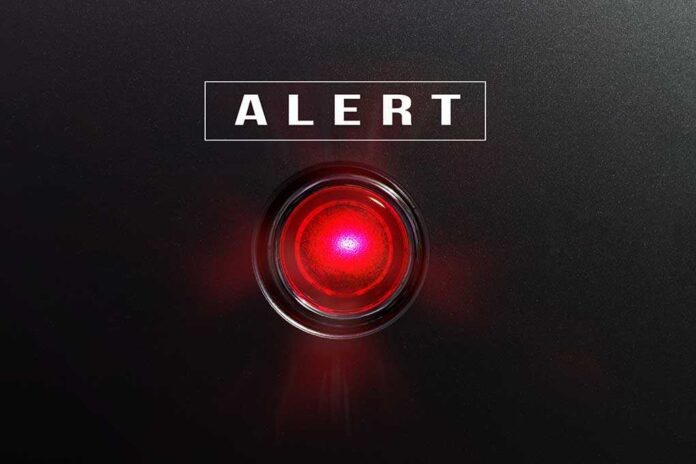 582441490 featured image Red alert button on black background.