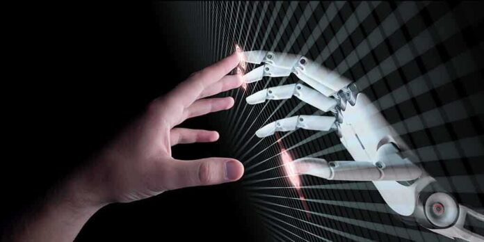 650850907 featured image Human and robotic hand reaching out to touch.