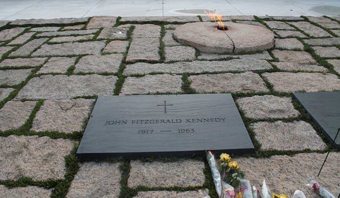 90209500 featured image plaque of John F Kennedy among stones