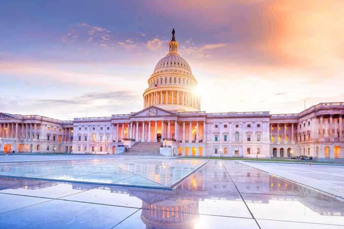 Capitol building at sunrise with a reflective foreground