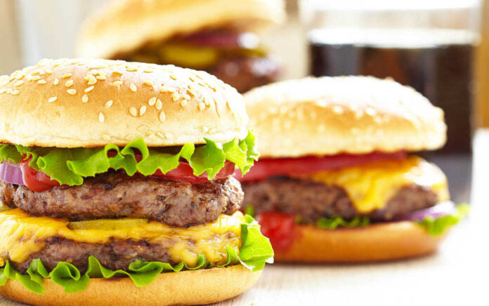 145994891 featured image Cheeseburgers with lettuce tomato and sesame seed buns