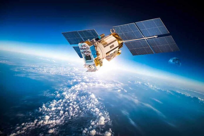 363654452 featured image Satellite orbiting Earth with moon in background.