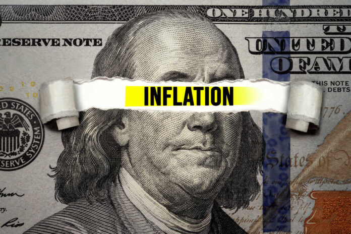 2299753463 featured image Inflation text over torn hundred dollar bill