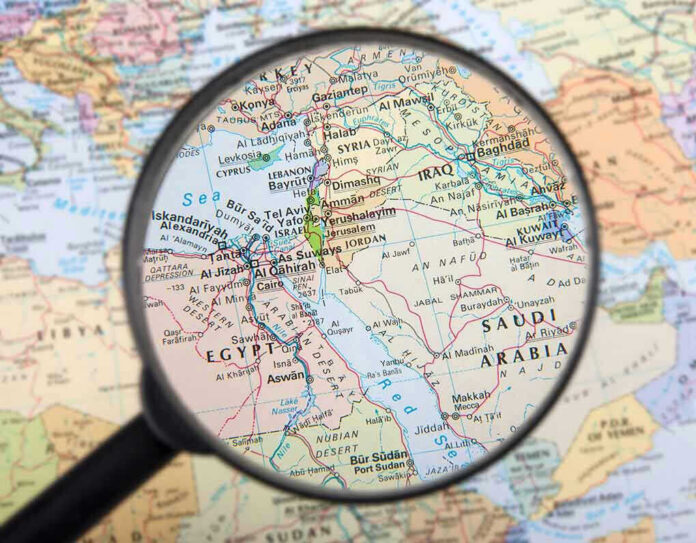 162063665 Magnifying glass over Middle East map highlighting Israel and Egypt