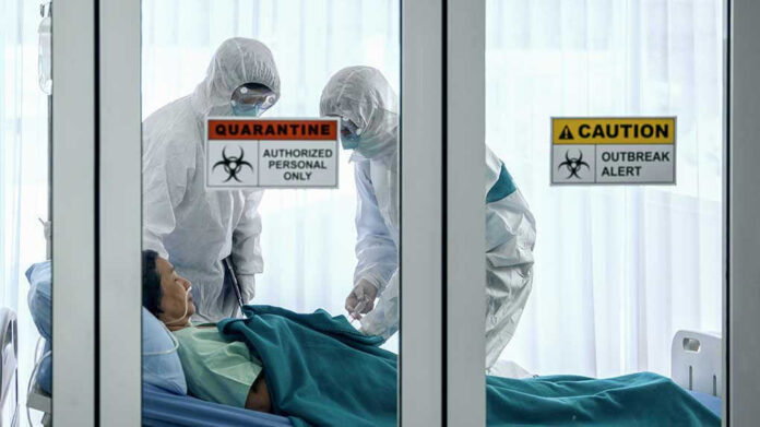 1647350797 Healthcare workers in protective gear in quarantine room