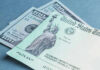 100 bill and US Treasury check