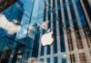 Glass building with large apple logo reflection