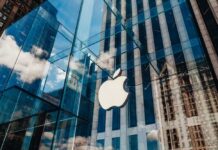 Glass building with large apple logo reflection