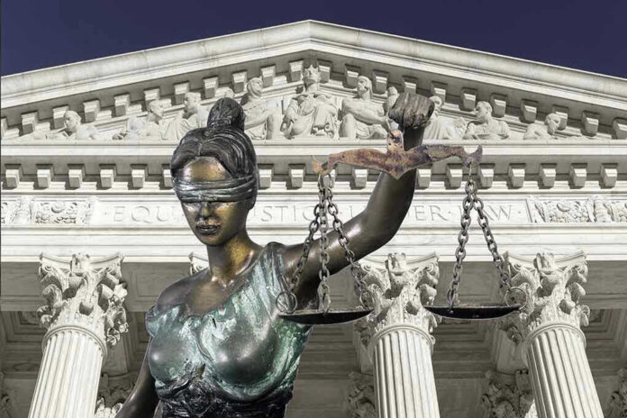 560959042 Lady Justice statue in front of courthouse