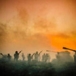 Soldiers and tanks in the foggy battlefield