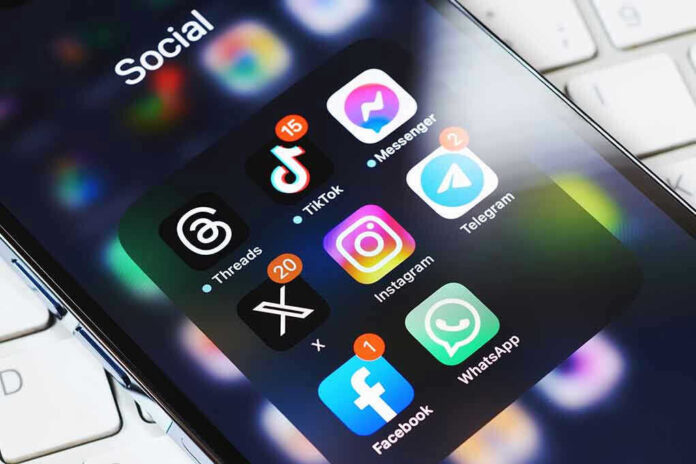 Smartphone showing social media app icons in a folder.