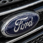 Ford logo on car grille close-up.