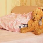 Three Child Murders Spark DCS Reform Outcry A cozy bedroom scene featuring a stuffed bunny and pink bedding