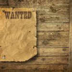 $110,000 Fendi Coat VANISHES—NYC Elite FURIOUS A vintage wanted poster pinned to a wooden wall