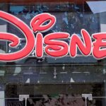 NEW Disney Death Rock Families — What’s Happening? Bright red Disney logo displayed on a storefront window
