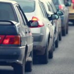 Explosive SUV Report — THESE Brands in Hot Water A line of cars stuck in traffic on a roadway