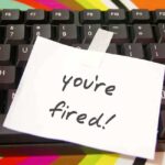 A note saying you're fired taped to a computer keyboard