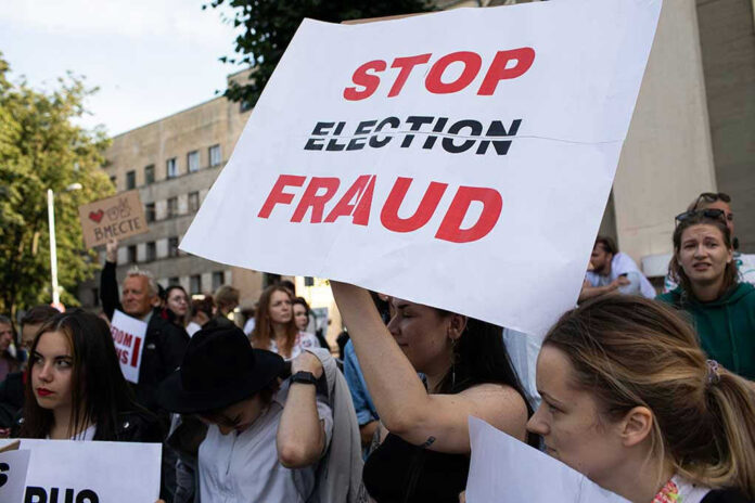 1797704578 People holding Stop Election Fraud protest signs.