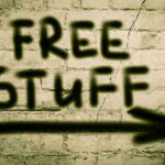 FREE Hotel Room: But You HAVE To Do THIS! Graffiti on brick wall says free stuff arrow