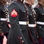 Deadly “Mishap” Exposes Pentagon Failure Marines in formal uniforms marching in a parade