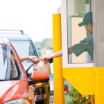 Drive-Thru Horror Pins Victim Customer receiving a food order at a drive-thru window