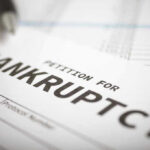 MAJOR RESTAURANT Brand COLLAPSES — $1.45B Debt Disaster Petition for bankruptcy document with pen.