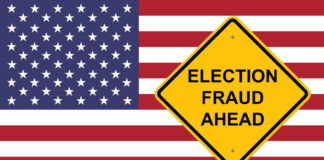 Yellow sign reading Election Fraud Ahead with American flag.