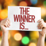 Court SHOCKER: Trump Wins Major Deportation Case Hands holding a sign reading The Winner Is...