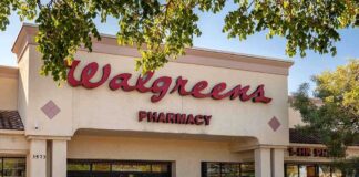 Exterior view of a Walgreens pharmacy with cars parked outside