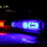 HORRIFIC Discovery — Restaurant Owners Found DEAD Close-up of police lights flashing in blue and red at night