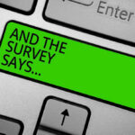 Green key with AND THE SURVEY SAYS