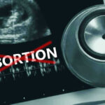 Governor Signs PERSONHOOD Shift—Doctors Alarmed Ultrasound, stethoscope, and ABORTION crossed out in red.