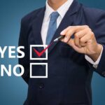 Deportation Poll Bombshell Shakes 2026 Race Business professional indicating a yes choice with a pen