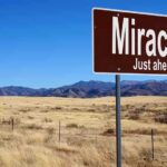 MIRACLE DOG Finds Missing Boy—Then Disappears A road sign reading 'Miracles Just ahead' in a desert landscape