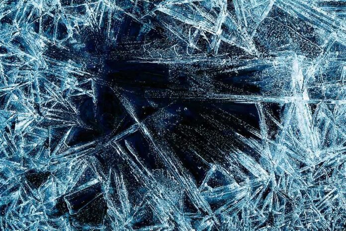 shutterstock_172341422.jpg Abstract ice patterns on a dark surface