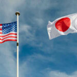 Japan UNLEASHES Arms Trade — Pacifist Era OVER USA and Japan flags flying on flagpoles.