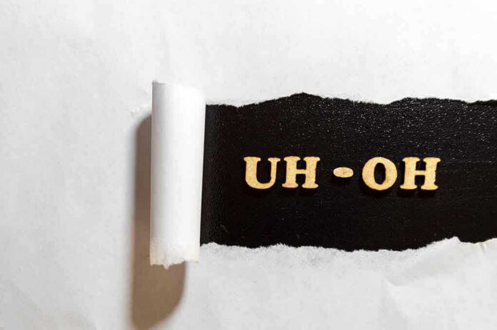 Torn paper revealing UH-OH text underneath.