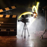 California Democrats Play Dumb On Camera Film set with clapperboard, camera, and lighting.
