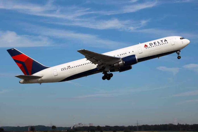 Delta airplane taking off from runway.
