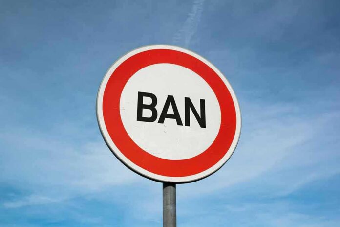 shutterstock_1759263689 (5).jpg A road sign displaying the word 'BAN' against a blue sky